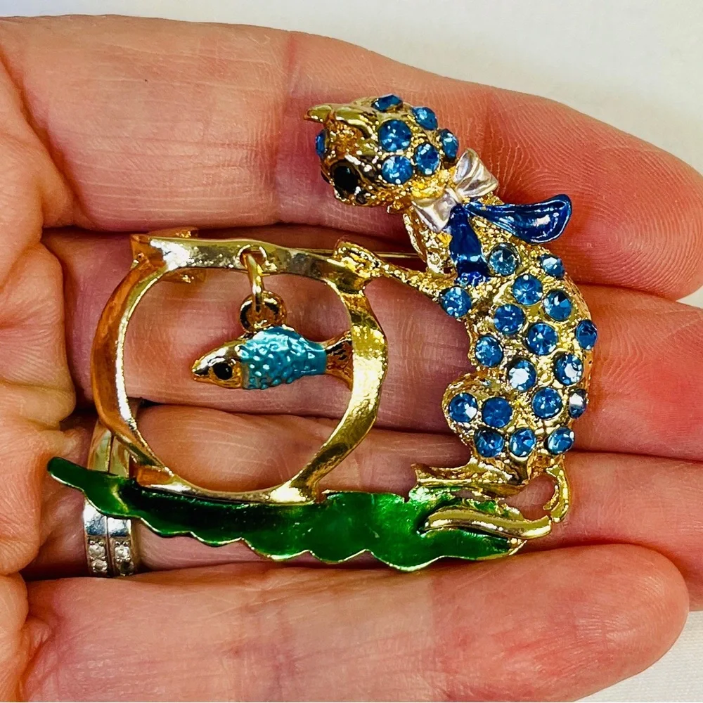 Brooch, Cat and Fish, NIP, blue rhinestones on golden base, 1.75x1.5”